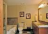 Bathroom with bath tub and separate shower.