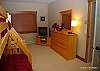 Mid floor- 5th bedroom with 2 sets of bunks with single over double bed. TV, chest of draws.
