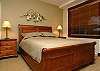 Queen bed, private bathroom to left. Window over looks hot tub.