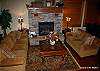 Main floor living room with gas fireplace and 20' ceilings.