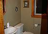 Handy half bathroom off main entryway.