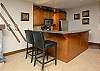 Gas fire to left of picture and compact kitchen.