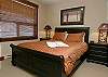 Queen bed, window overs building 2.