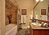 Stonegate 1 401 top floor lofted condo. Ensuite bathroom to master bedroom.