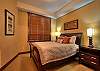 Stonegate 3 405 master bedroom with queen bed.