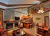 Stonegate 1 401 top floor lofted condo. Living room, dining area and kitchen.