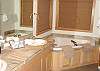 Lower level Master Bathroom with Jacuzzi tub, shower and double sinks.