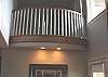 Balcony overlooking the living room with sitting room.