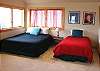 Second view - Upper level - Bedroom/Sitting room with a Queen bed and Twin bed (TV is non functional) with a door out to the private deck.