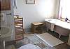 Lower level - Master Bathroom with claw foot bath tub and pedistal sink.