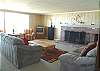 Second view - Lower Level - Living room with TV/VCR, wood burning fireplace and spectacular ocean views.