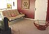 Second view - Upper level - Loft style bedroom with a Queen bed, TV/DVD, futon for additional sleeping and full office with DSL.