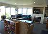 Living room with TV/VCR/DVD, gas fireplace and two hide a beds for additional sleeping, spectacular ocean views.