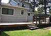 Grassy backyard with deck