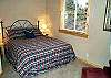 Upper level bedroom with a Queen bed.