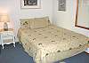 Master bedroom with a Queen bed and TV.
