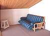 Loft sitting area on upper level with Futon, over looks the living room and ocean