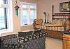 Upper level - Master Bedroom with a King bed with sitting area with TV/VCR/DVD and spectacular ocean front views.  Private bathroom with a tub and shower.