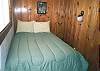 Upper level bedroom with a Double bed and Twin bed.