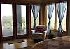 Third view - Lower level - Master Bedroom with a Queen, gas fireplace, door to deck and spectacular ocean views.  Private bathroom with Jacuzzi tub and large glass shower.