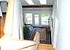 Stairs to lower level and Apartment