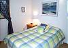 Upper level - Bedroom with a Queen bed and a skylight.
