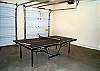 Lower level - Garage with ping pong table.