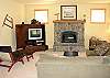 Lower level - Large living room with TV/VCR/DVD and gas fireplace.