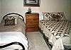 Lower level bedroom with a Queen bed and a Twin bed.