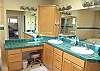 Large master bathroom with double sinks, Jacuzzi tub and large shower.