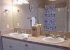 Upper level - Master bathroom with double sink and tub/shower.