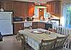 Upper level - Fully equipped kitchen with dining table for 6.