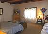 Second view - Upper level - Master bedroom with a Queen bed and TV with a private bathroom with a Jacuzzi tub and large shower.