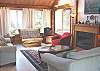 Upstairs Living room with Electric Fireplace, TV/VCR, partial ocean views.
