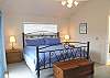 Upper level - Master bedroom with a king bed, slider out to private east facing deck.