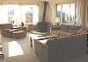 Second view of upstairs Living room with wood stove.