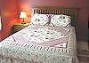 Lower level - Bedroom with a Double bed, slider to backyard.