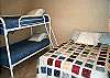 Lower level bedroom with a Double bed and a Twin Bunk bed.