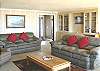 Third view - Lower Level - Living room with TV/VCR, wood burning fireplace and spectacular ocean views.