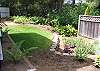 Grassy backyard with deck