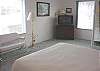 Second View of Queen Bedroom Downstairs with TV