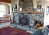 Second view - Upper level-Living room with flat screen TV/DVD, CD stereo, wood stove insert and spectacular ocean views.