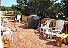 South facing deck with gas BBQ and lots of patio furniture.