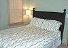 Bedroom with a Queen Bed (slider to grassy backyard).