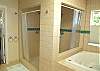 Third view - Large master bathroom with double sinks, Jacuzzi tub and large shower.