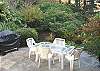 Large back patio with gas BBQ and patio furniture.
