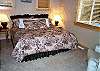 Upper level Master bedroom with a King bed and private bathroom.