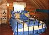 Upstairs Loft Bedroom with a Queen, overlooks living room.