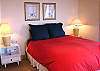 Lower level - Bedroom with a Queen bed, ocean views and private bathroom with tub and shower.