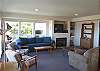 Second view - Living room with TV/VCR/DVD, gas fireplace and two hide a beds for additional sleeping, spectacular ocean views.